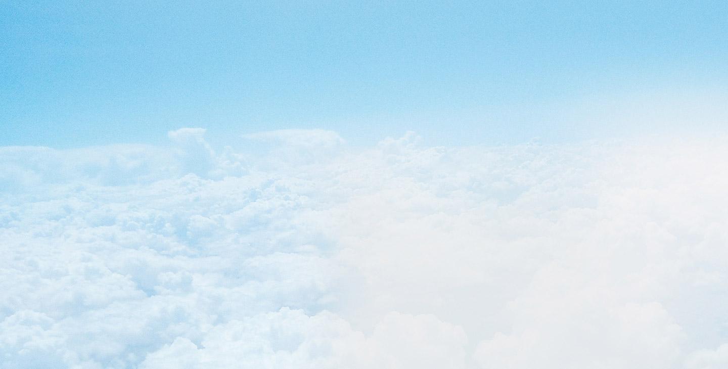 A blue sky filled with fluffy white clouds