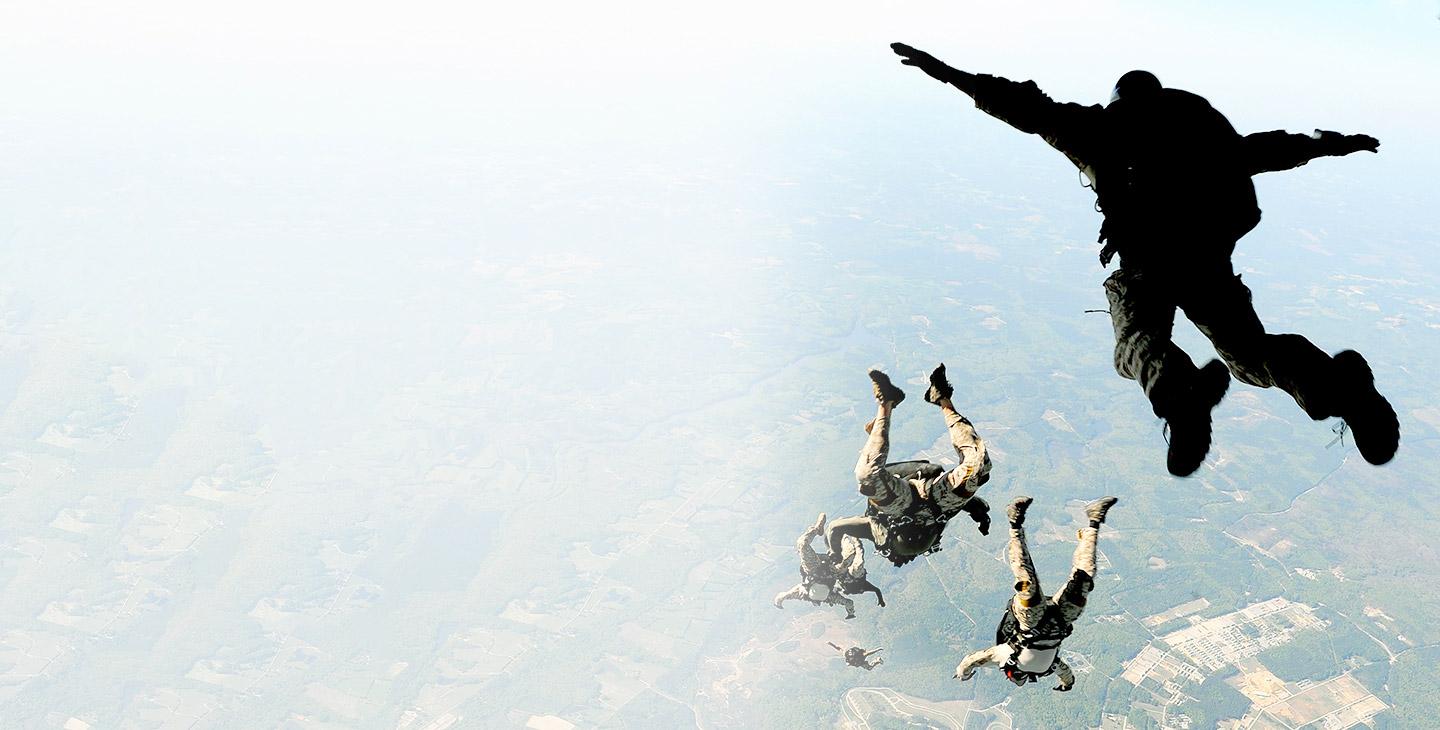 Paratroopers jumping out of an aircraft